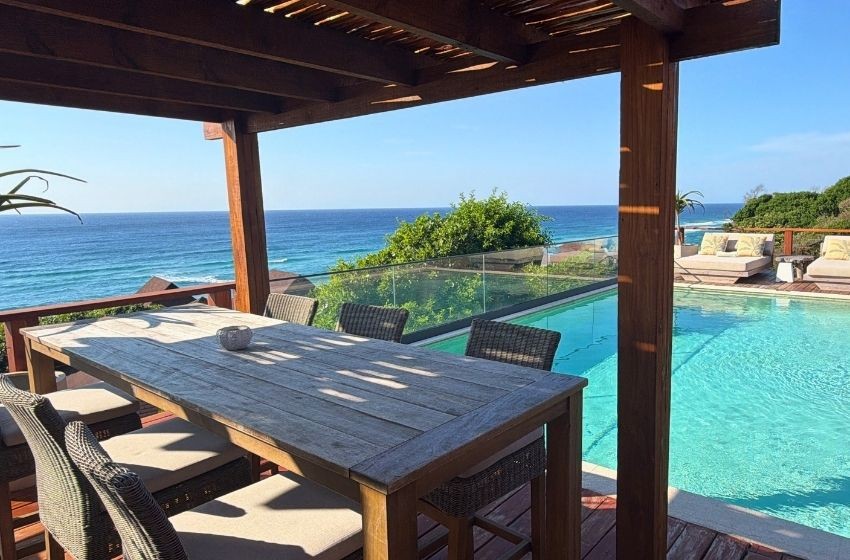 Exterior dining area with view of the pool and sea Aloha 28 Ponta Mamoli