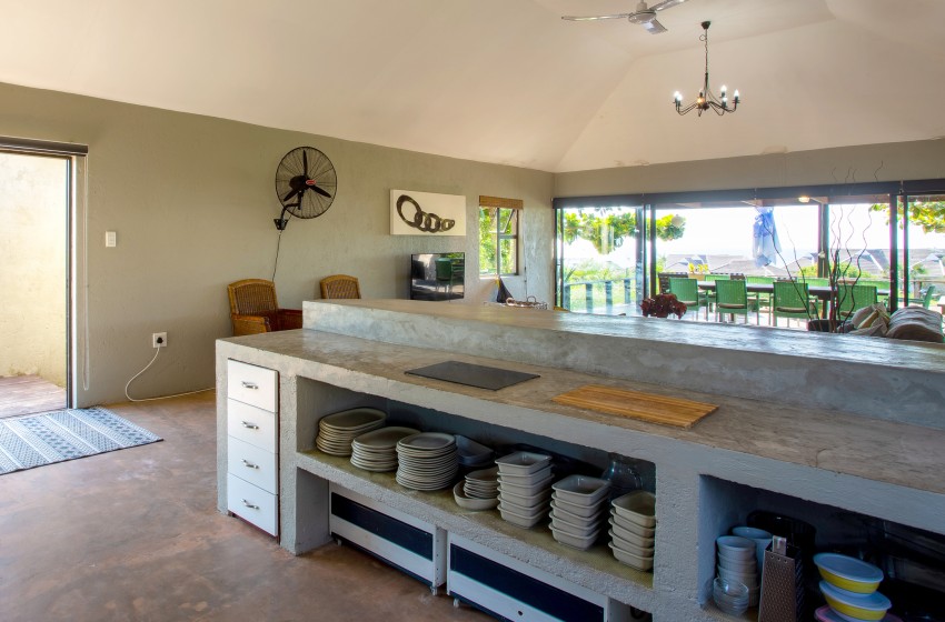 Kithcen with crockery in view at Baleia Azul 15 in Ponta Mamoli