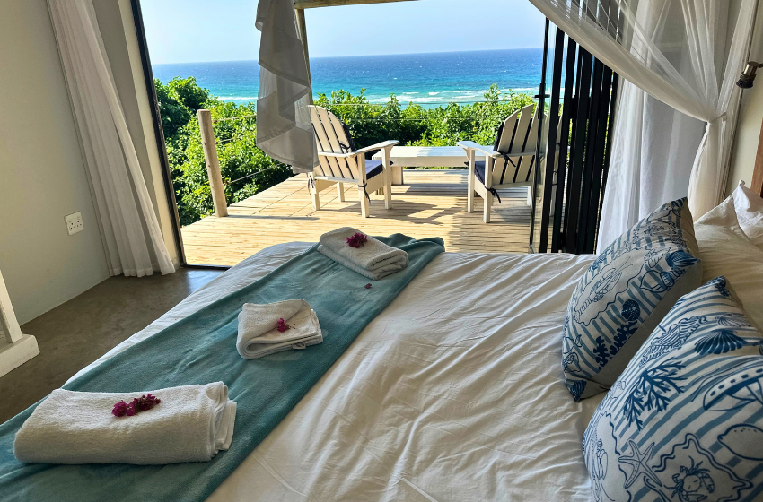 bedroom 1 with sea view at Baleia Azul 11 in Ponta Mamoli