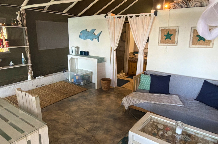 living area at Baleia azul beachfront tent 7 in Ponta Mamoli