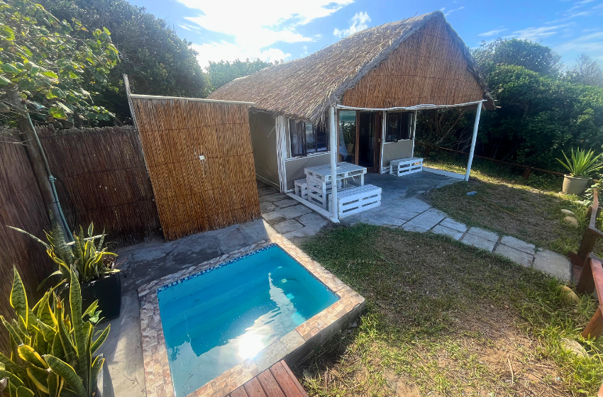 outdoor shower and pool at Baleia azul beachfront tent 8 in Ponta Mamoli