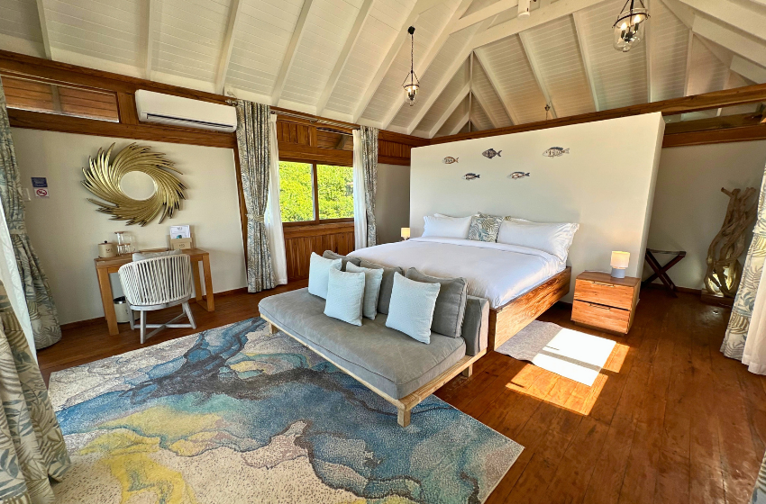 bedroom 1 with side table at Aloha 5 in Ponta Mamoli